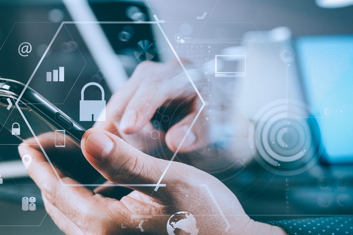 Cyber security internet and networking concept. Businessman hand working with VR screen padlock icon mobile phone on computer background.
